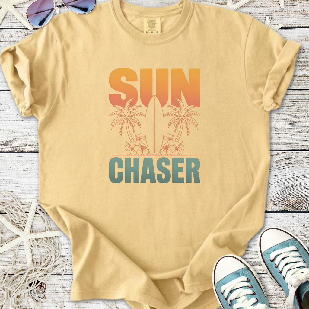 Beige unisex t-shirt featuring 'SUN CHASER' design with surfboard and palm trees, perfect for beach lovers.