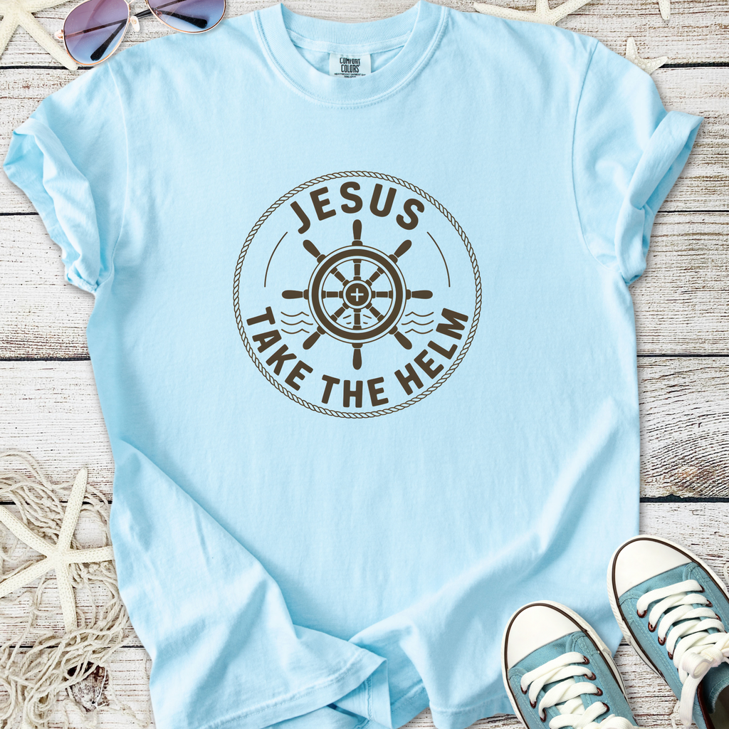 Light blue cotton t-shirt with 'Jesus Take the Helm' graphic and ship's wheel design.