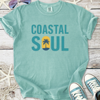 Mint green t-shirt with 'Coastal Soul' graphic and palm tree design, made from soft, comfortable material.