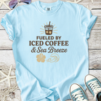 Light blue t-shirt with graphic 'Fueled by Iced Coffee & Sea Breeze', perfect for casual summer wear.