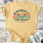 Cream retired and sun-kissed graphic tee, featuring tropical design. Perfect for casual island living.