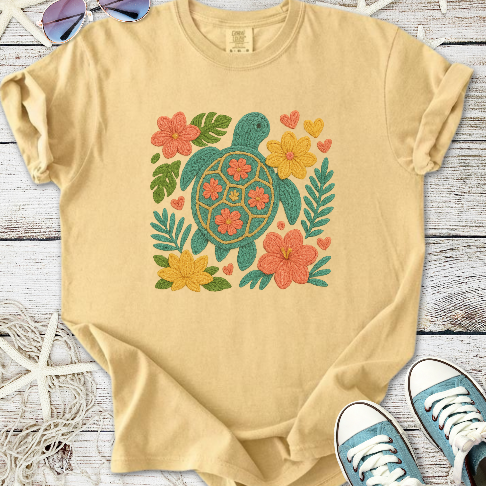 Yellow casual t-shirt with turtle and floral embroidery design, perfect for beach lovers.