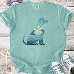 Mint green dog graphic tee featuring ocean waves and sunset design, made from soft cotton material.
