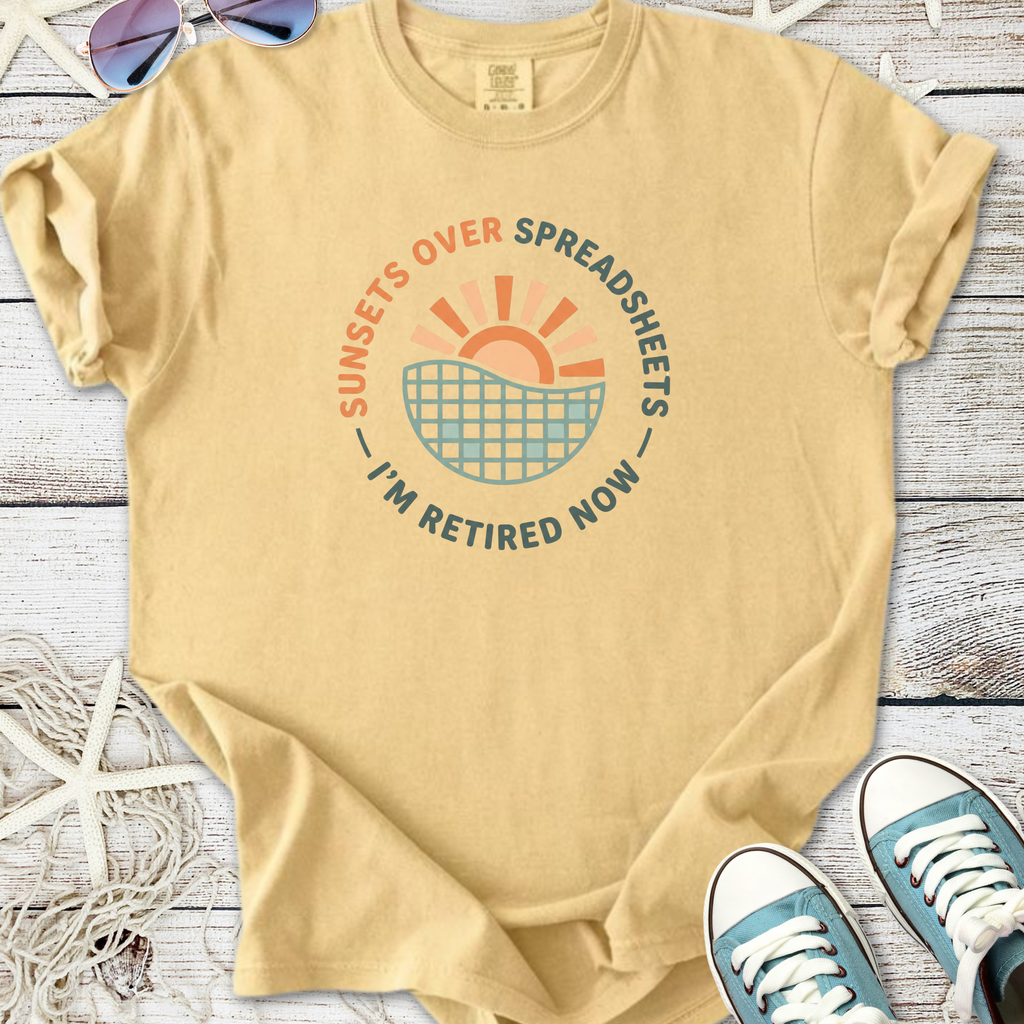 Light yellow retirement t-shirt featuring a sunset graphic and 'Sunsets Over Spreadsheets' text.