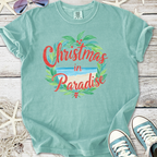 Mint green t-shirt featuring 'Christmas in Paradise' graphic design, perfect for holiday beach vibes.