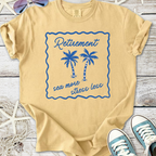 Light yellow retirement t-shirt with blue palm tree graphic and slogan 'sea more stress less'.