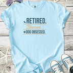 Light blue t-shirt with 'Retired. Blessed. Dog Obsessed.' graphic printed on it.