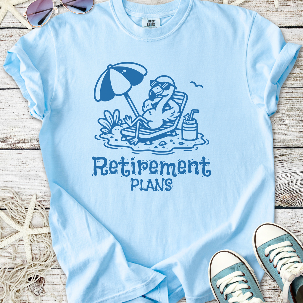 Light blue retirement plans t-shirt featuring a lounging flamingo illustration.
