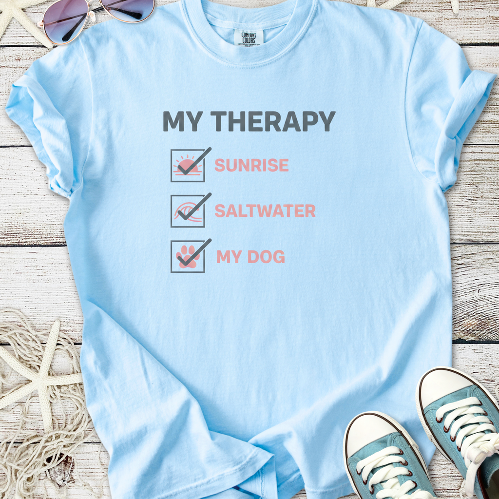 Light blue graphic tee with 'My Therapy' print, featuring sunrise, saltwater, and dog icons.