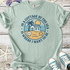 Light green t-shirt with beach graphic, palm tree, and text 'In a Cottage by the Sea' perfect for summer.