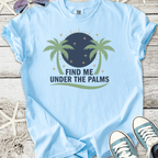 Light blue t-shirt with palm tree design and 'Find Me Under the Palms' text, perfect for summer wear.