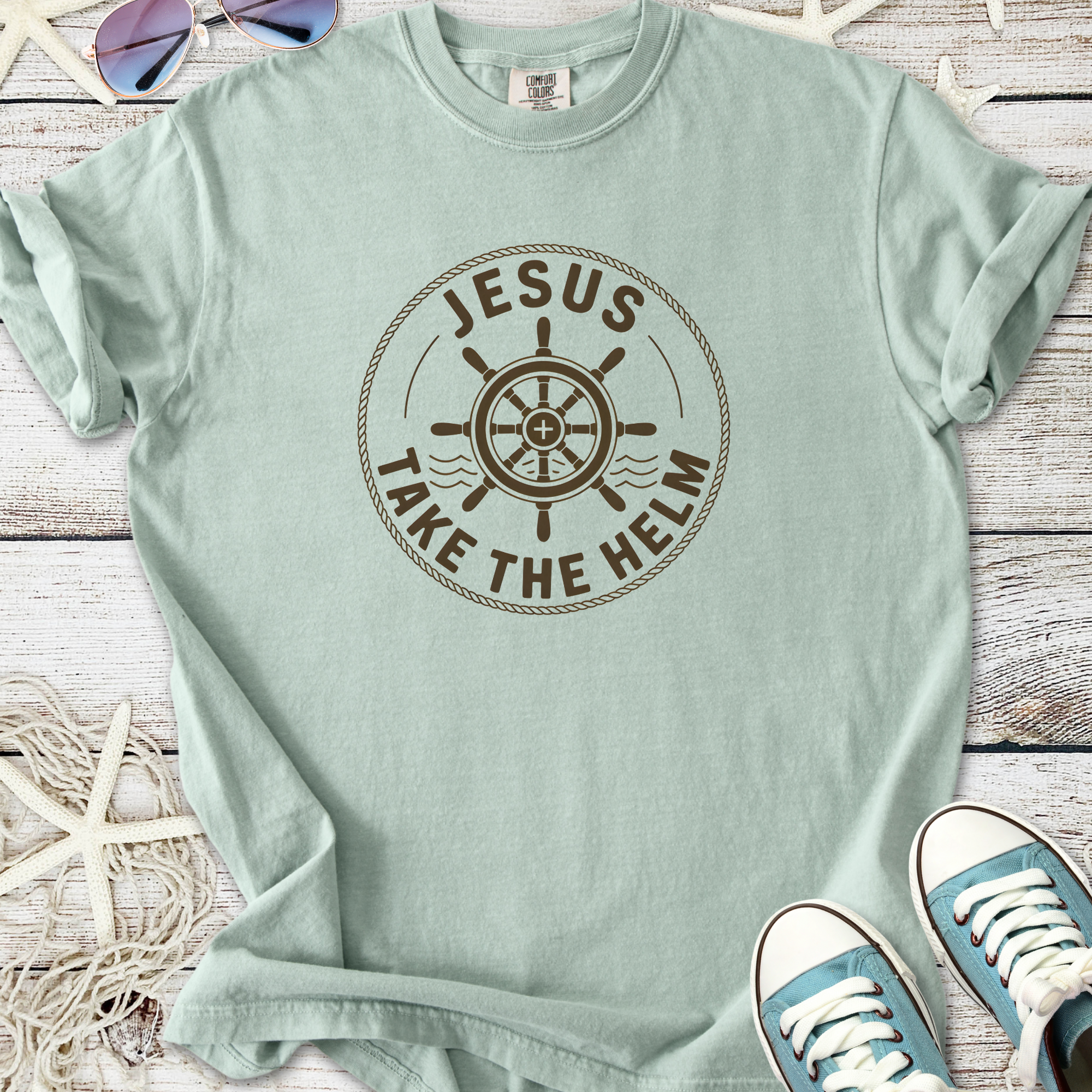 Mint green t-shirt with 'Jesus Take the Helm' graphic, perfect for casual or faith-inspired wear.