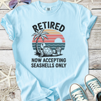 Light blue t-shirt with 'Retired' graphic, featuring a turtle, palm tree, and sunset design.