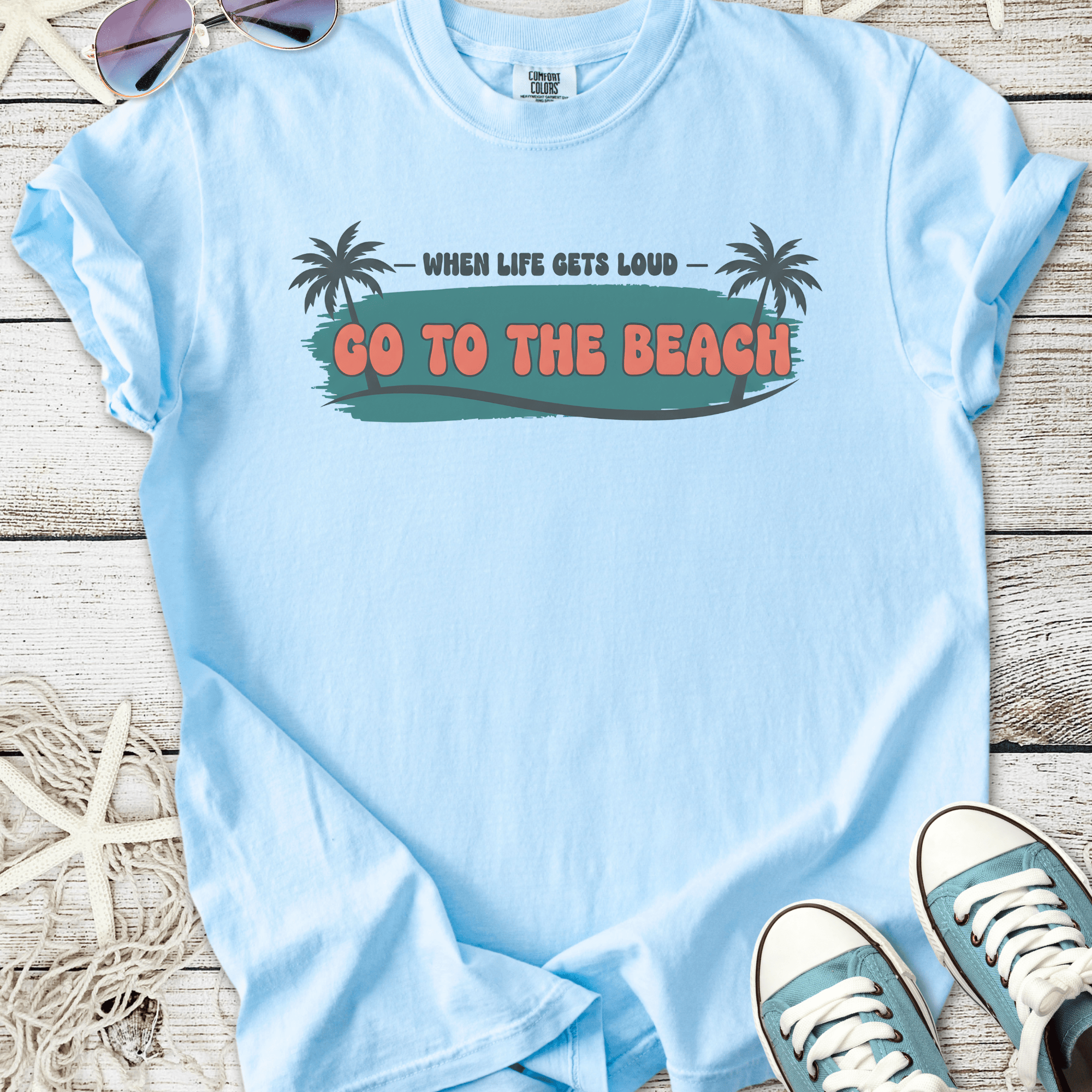 Light blue cotton t-shirt with 'Go to the Beach' graphic and palm tree design, perfect for summer.