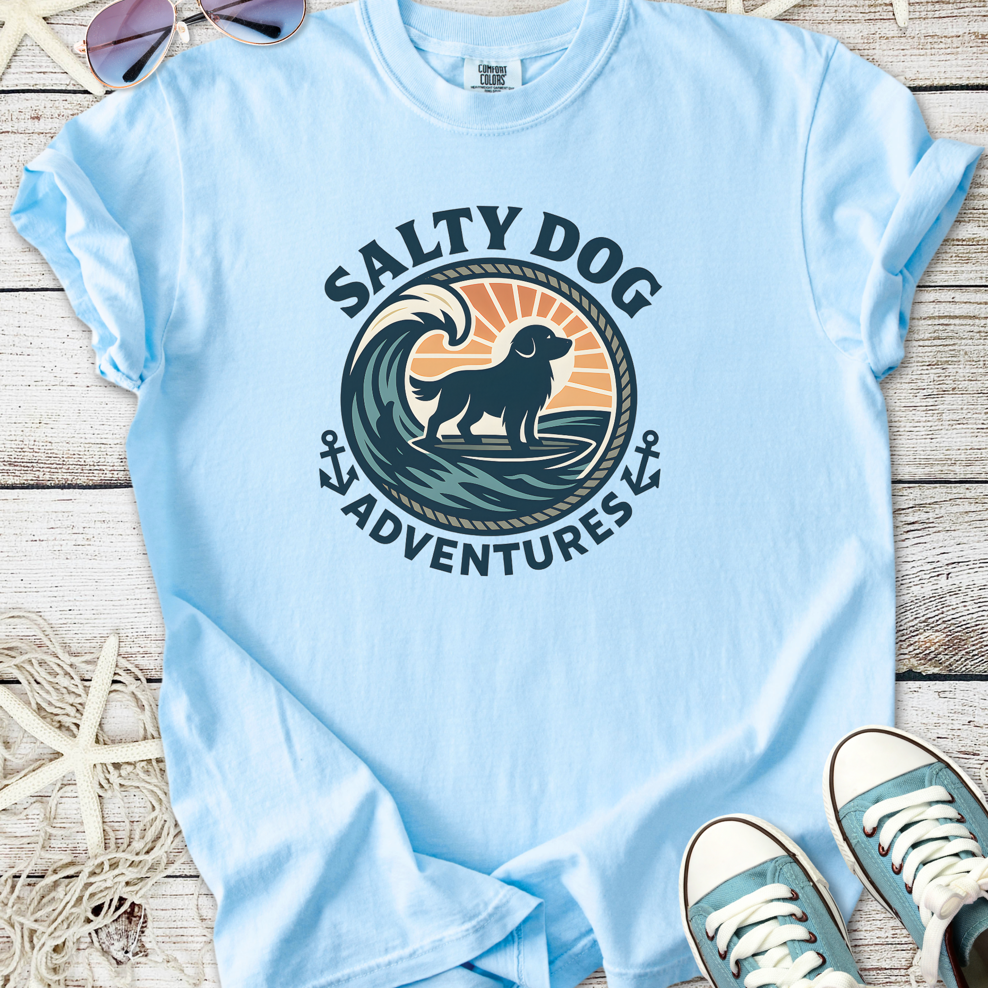 Light blue t-shirt featuring a 'Salty Dog Adventures' graphic with a dog and wave design.