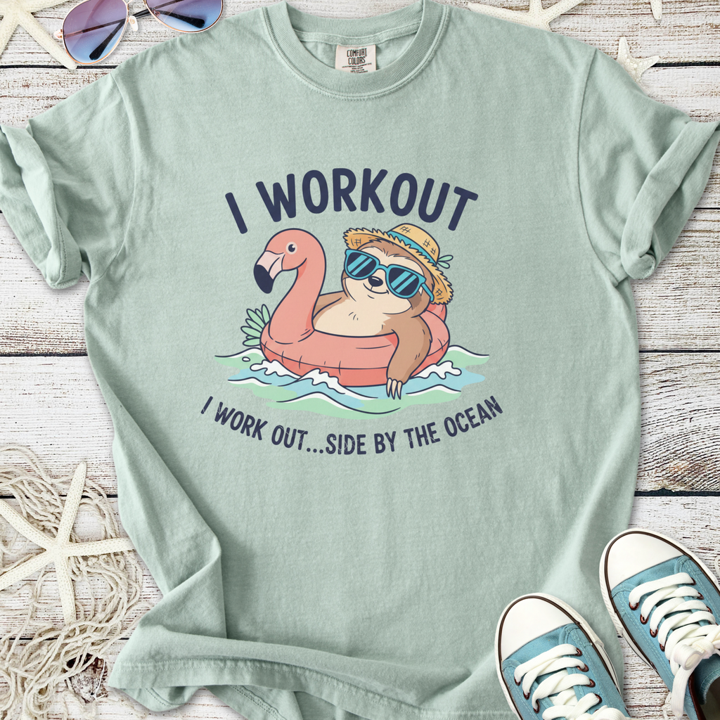 Mint green t-shirt with a sloth and flamingo graphic, perfect for beach lovers and casual wear.