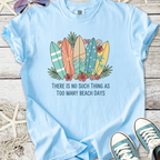Light blue t-shirt with surfboard graphic and floral design, perfect for beach lovers.