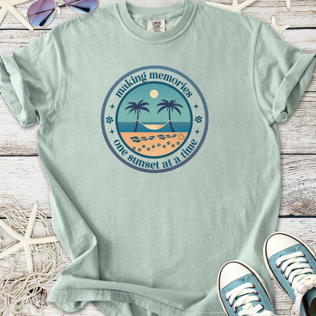 Light green cotton t-shirt with sunset and palm tree graphic, perfect for beach lovers.