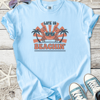 Light blue t-shirt with 'Life is Beachin'' graphic featuring a crab and palm trees, ideal for summer.