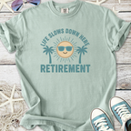 Light green retirement t-shirt with beach-themed graphic and relaxed fit, perfect for laid-back days.