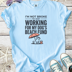 Light blue t-shirt with funny 'Dog's Beach Fund' graphic, made from soft cotton, perfect for dog lovers.