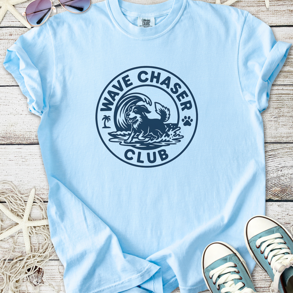 Light blue cotton t-shirt featuring 'Wave Chaser Club' graphic with a dog and waves design.