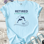 Light blue t-shirt with 'Retired & Forever Salty' print, featuring dolphins and a turtle design.