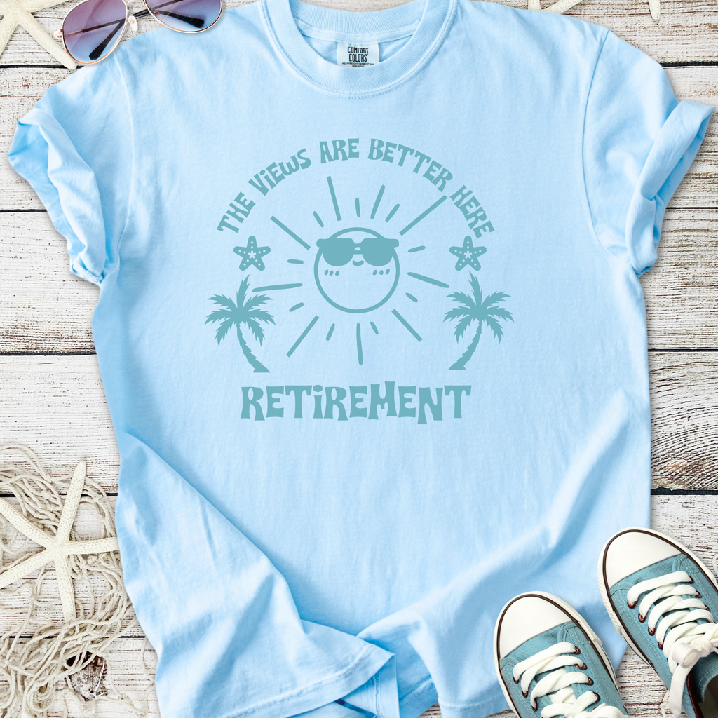 Light blue retirement t-shirt with fun sun graphic and palm trees, perfect for sunny days.