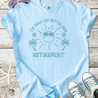 Light blue retirement t-shirt with fun sun graphic and palm trees, perfect for sunny days.