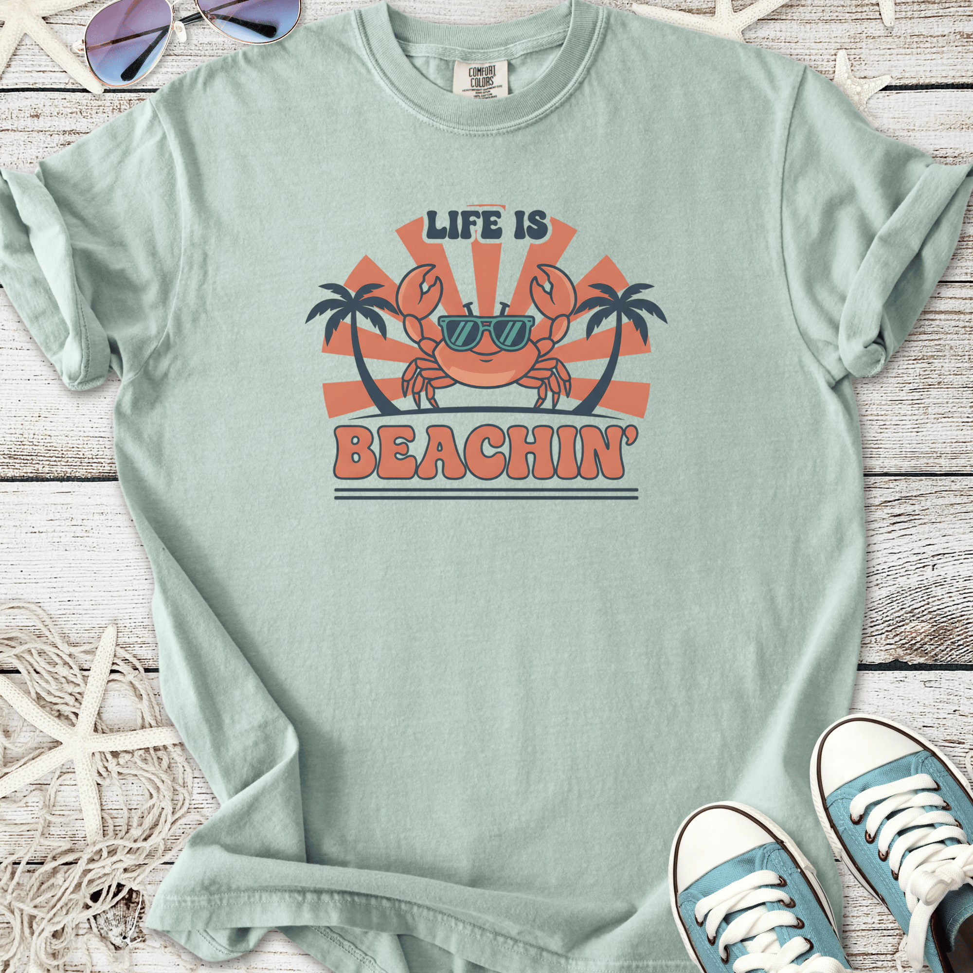Mint green 'Life is Beachin'' graphic t-shirt featuring a cool crab and palm trees design.