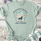 Light green t-shirt with a Frenchie design, featuring beach-themed graphics, perfect for dog lovers.