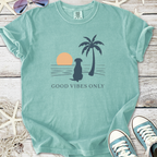 Mint green 'Good Vibes Only' t-shirt with dog, palm tree, and sunset graphic design.