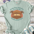 Mint green t-shirt featuring a Tiki bar graphic with text about relaxation and self-care.