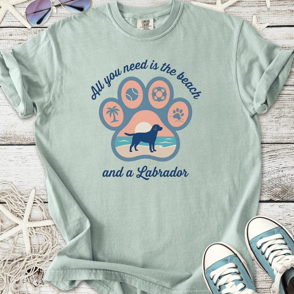 Light teal t-shirt with beach-themed Labrador graphic and quote, perfect for dog lovers.
