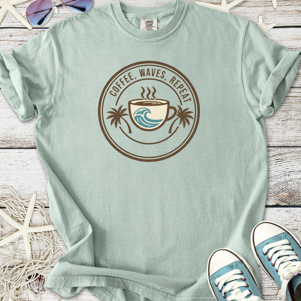 Light green t-shirt featuring 'Coffee, Waves, Repeat' graphic with coffee cup and wave design.