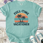 Light teal t-shirt with 'Full-Time Vacationer' graphic, featuring palm trees and sunset stripes.