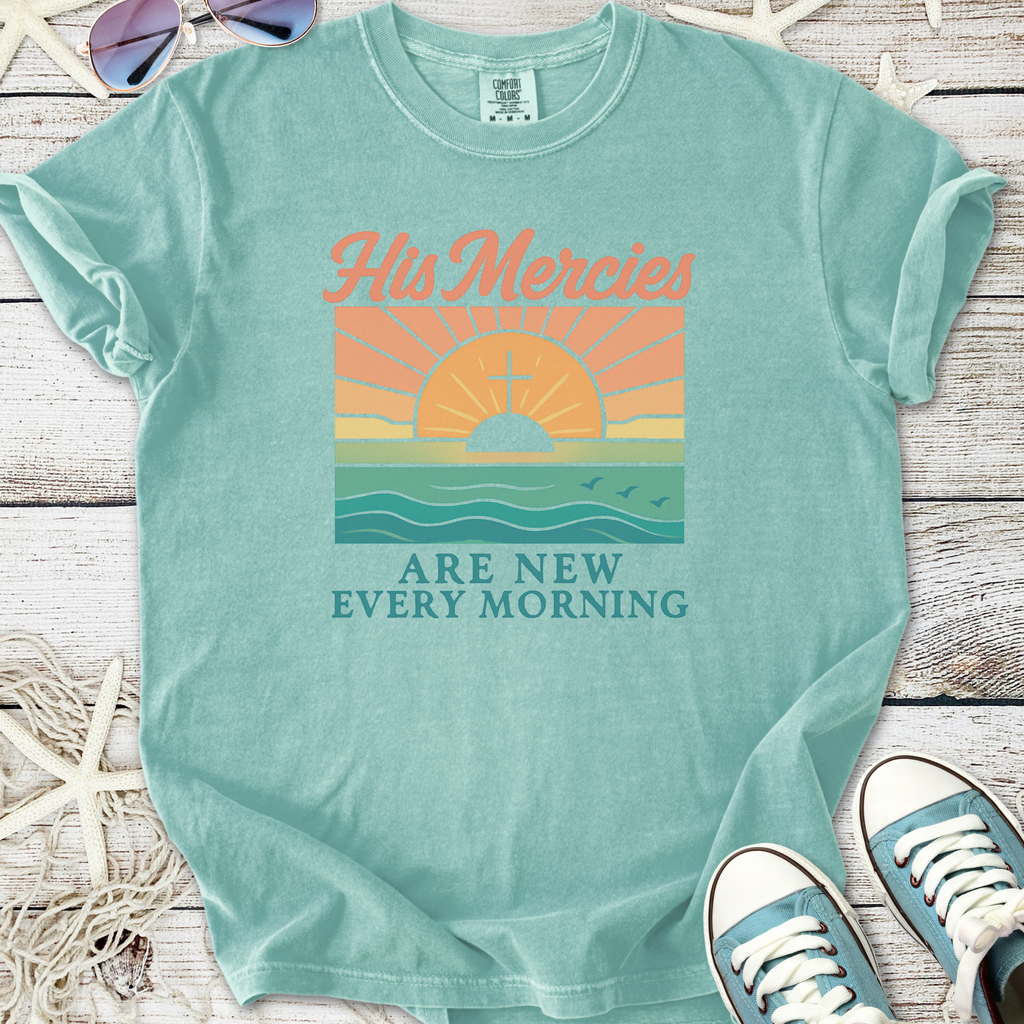 Light blue graphic t-shirt with sunrise and 'His Mercies Are New Every Morning' design, soft cotton material.