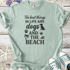 Mint green t-shirt with black print: 'The best things in life are dogs and the beach'.