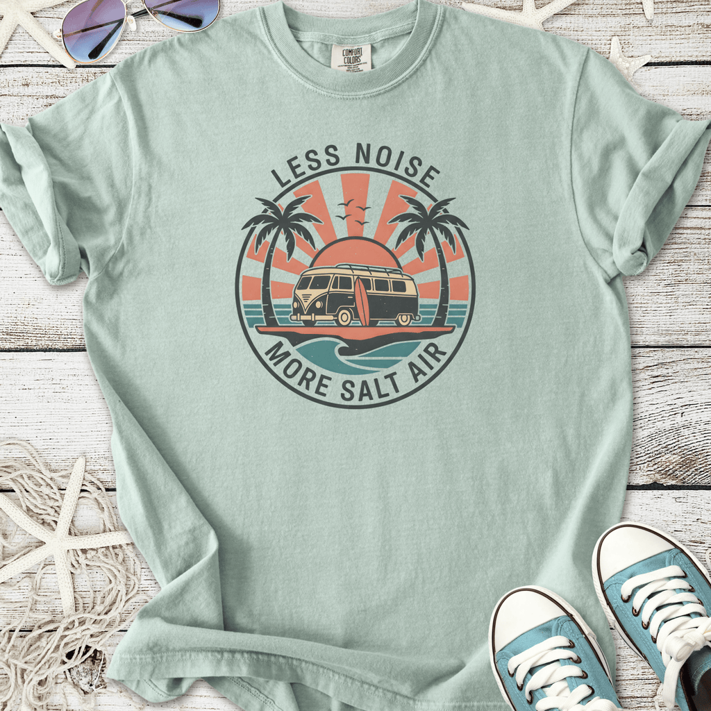Mint green graphic t-shirt featuring a retro van and palm trees with 'Less Noise, More Salt Air' slogan.
