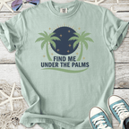 Light mint green t-shirt featuring palm tree design and 'Find Me Under The Palms' text.