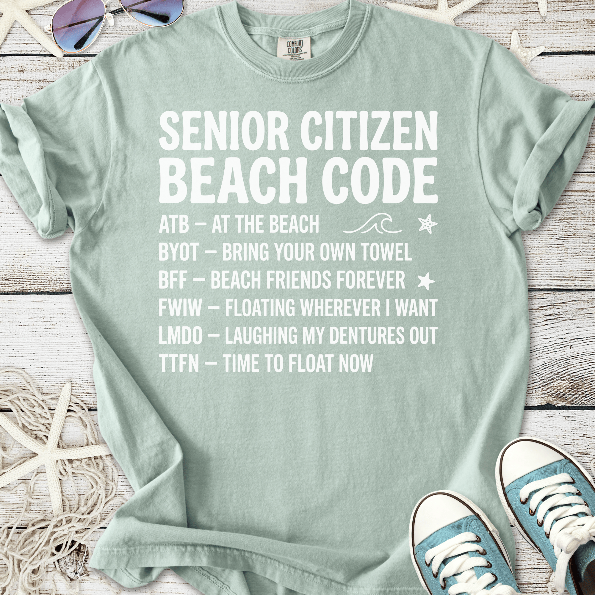 Mint green t-shirt with 'Senior Citizen Beach Code' graphic, perfect for beach lovers and fun outings.