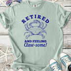 Light blue retired t-shirt with crab graphic and 'Claw-some!' text, perfect for casual wear.
