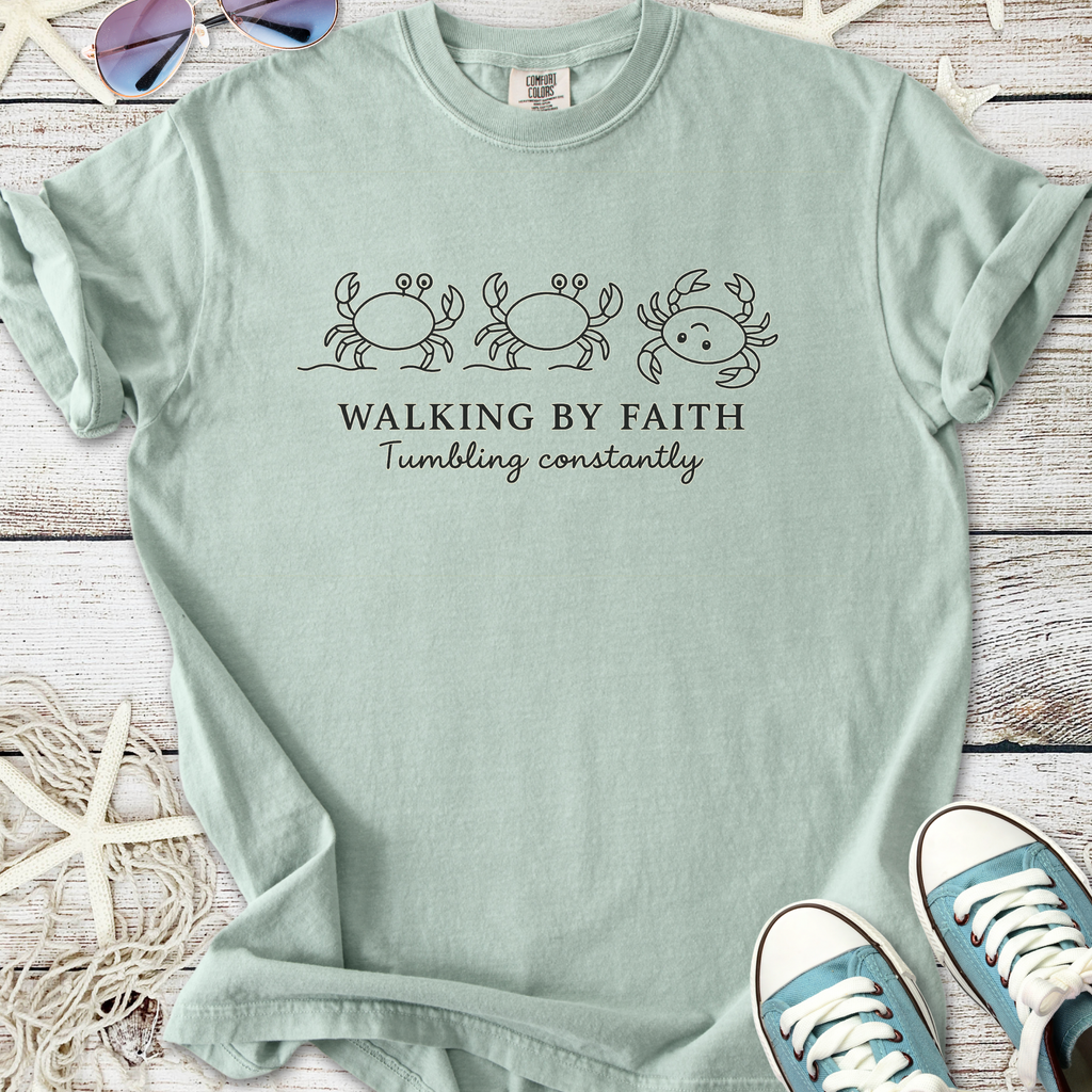 Seafoam green t-shirt with crab graphics and 'Walking by Faith' text, made from soft cotton.