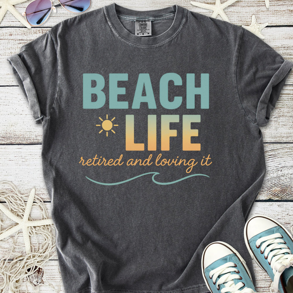 Gray graphic tee featuring 'Beach Life' design, perfect for retirees who love the sun and sea.