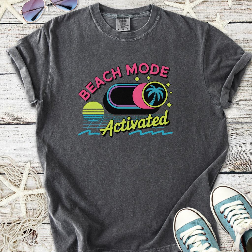 Gray graphic t-shirt featuring 'Beach Mode Activated' design with palm trees and sunset graphics.
