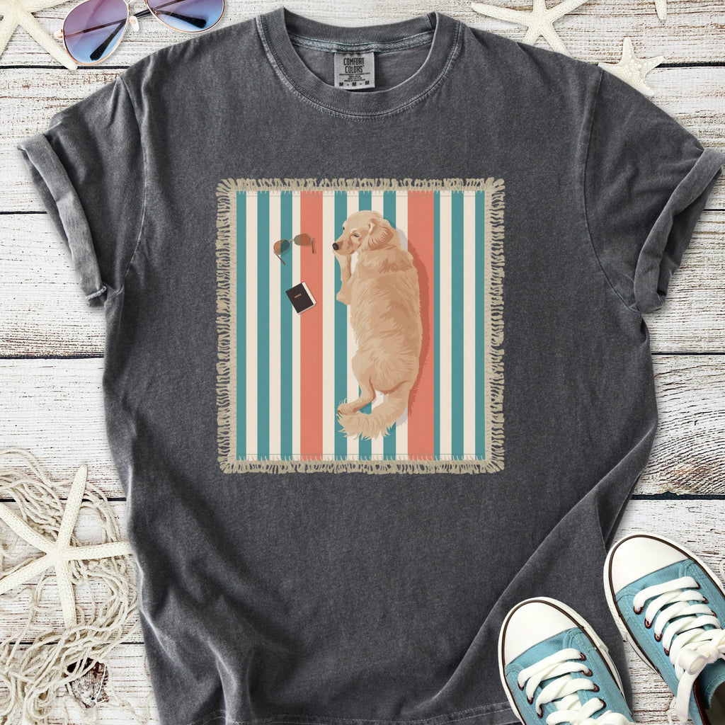 Graphic gray t-shirt featuring a golden retriever lounging on a striped blanket with sunglasses and a book.