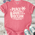 Pink graphic t-shirt featuring 'Peace Quiet Ocean' design, perfect for beach lovers and casual wear.