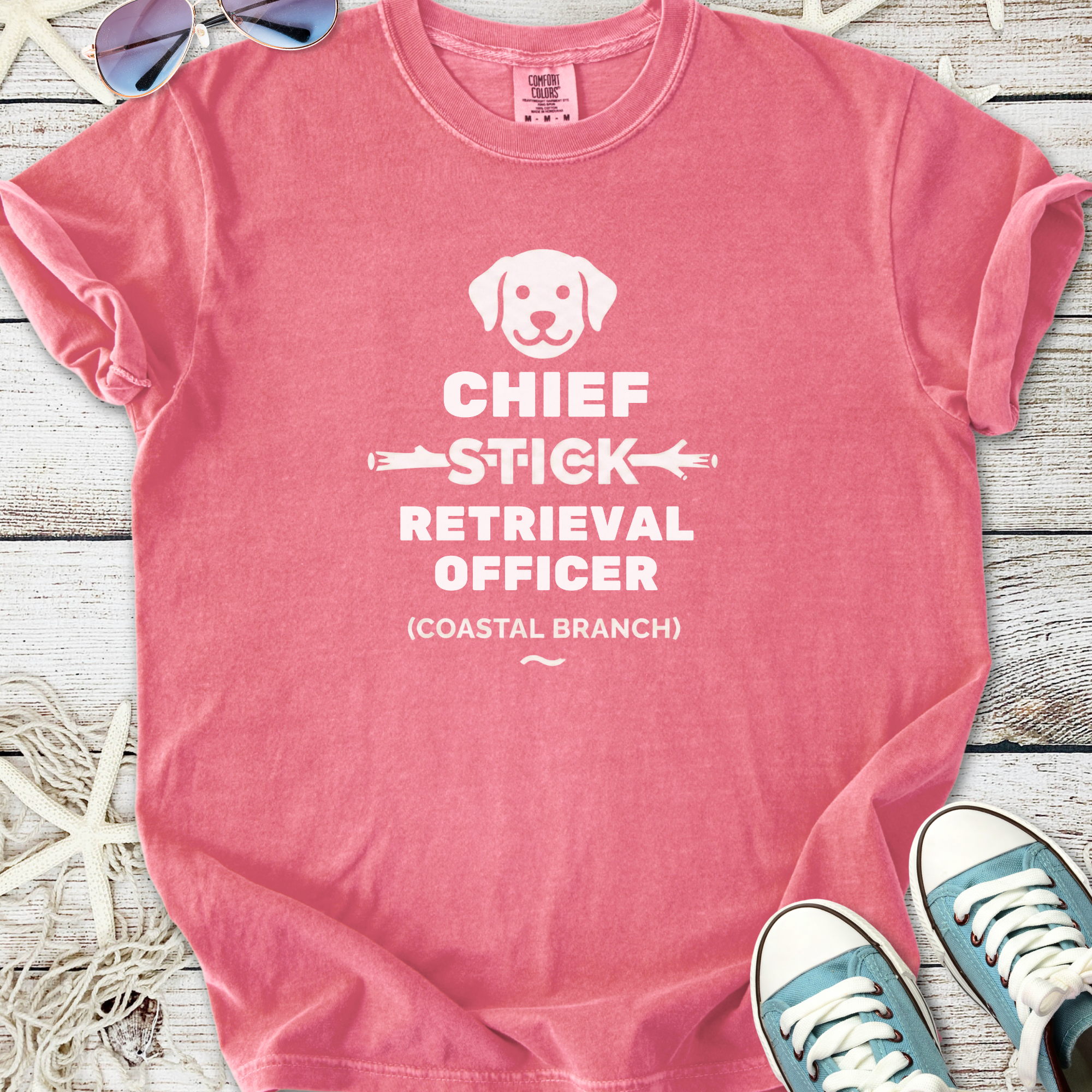 Pink t-shirt featuring 'Chief Stick Retrieval Officer' graphic, perfect for dog lovers and beach outings.
