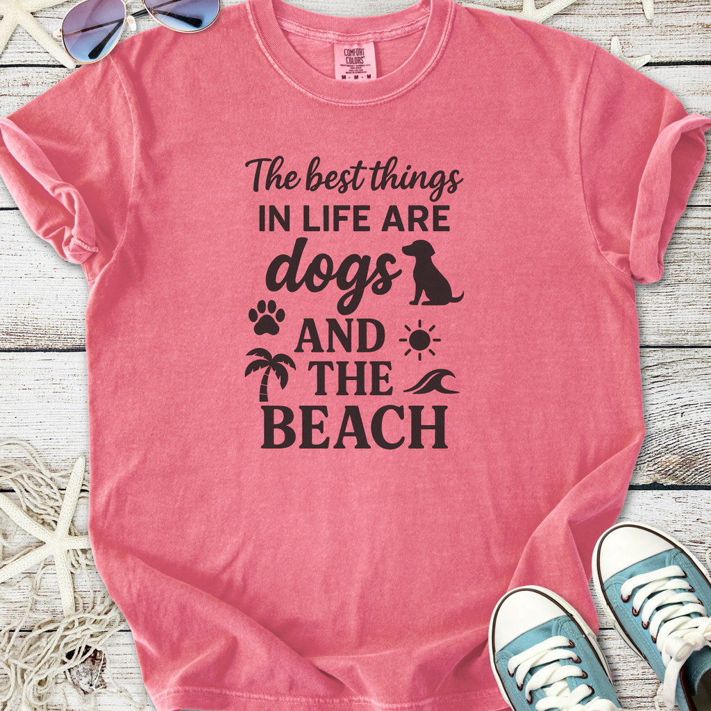 Pink cotton t-shirt with beach and dog-themed graphic design, perfect for casual summer wear.
