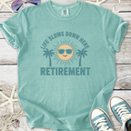 Light teal retirement t-shirt with a sun and palm trees graphic, perfect for vacation vibes.